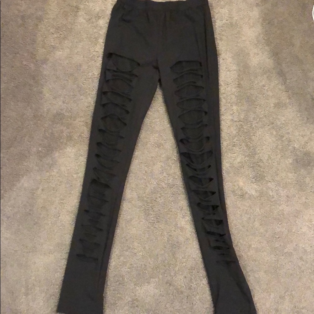 Black leggings w/ rips and mesh under. Size S